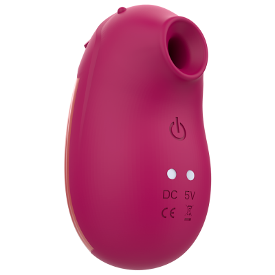 Aparelho rosa pequeno com botão e marcações DC 5V e CE