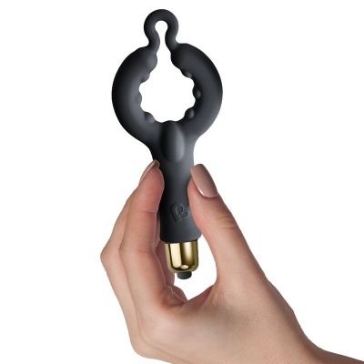 anel vibratório preto de silicone com botão dourado na base