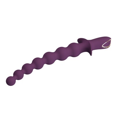 Produto roxo ondulado com esferas e detalhes dourados