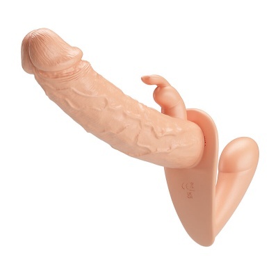 Vibrador cor de pele com textura realista e estimulador adicional.