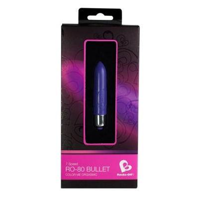 Embalagem preta e rosa com vibrador roxo visível no centro