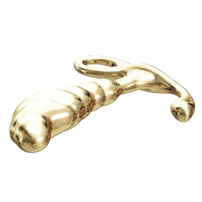 Objeto metálico dourado com forma segmentada e extremidades curvas