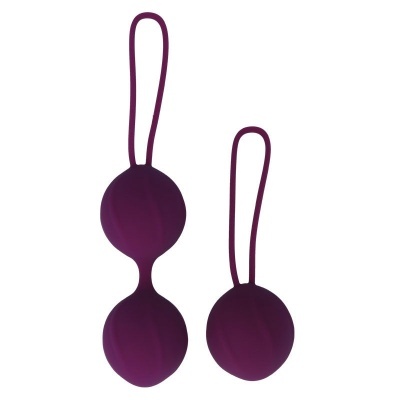 Bolas de exercício pélvico de silicone roxo em fundo branco