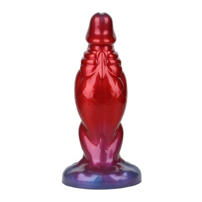 Objeto decorativo em forma de pássaro vermelho com base roxa