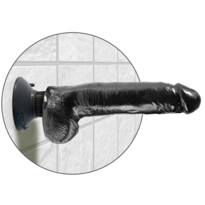Dildo preto com ventosa numa parede de azulejos brancos