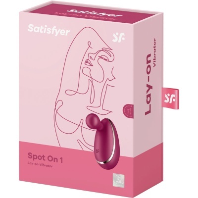 Embalagem rosa e vinho de vibrador Spot On 1 da marca Satisfyer com desenho linear de rosto.