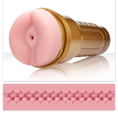 Brinquedo sexual masculino com invólucro dourado e textura interna rosa clara