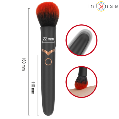 Pincel de maquilhagem preto e vermelho com medidas na lateral e detalhes em cobre