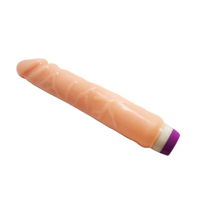 Vibrador cor de pele com tampa roxa sobre fundo branco