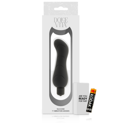 Vibrador preto de silicone em embalagem branca ao lado de pilha Kodak