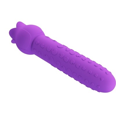 Produto roxo cilíndrico com texturas de corações e detalhes em forma de orelhas.