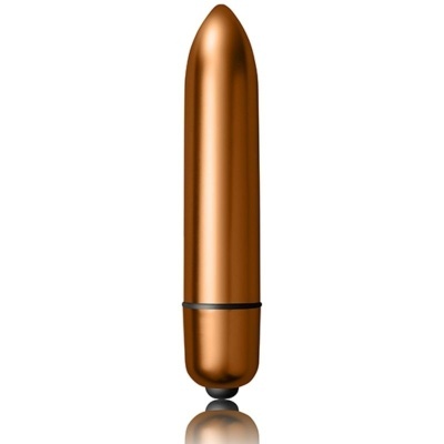 vibrador cilíndrico metálico de cor cobre com base preta