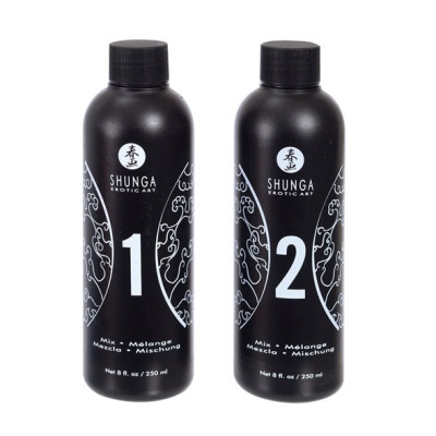 Dois frascos pretos SHUNGA EROTIC ART numerados 1 e 2 com texto em vários idiomas e 250 ml