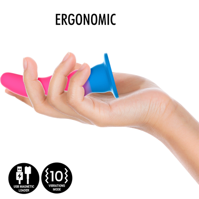 Objeto ergonómico rosa e azul em silicone nas mãos com selo USB e 10 modos de vibração