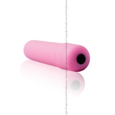 Objeto cilíndrico cor-de-rosa com ponta preta sobre fundo branco