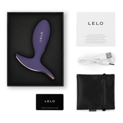 Conjunto produto LELO com objeto roxo, manual, cabo USB, cartão garantia e saco preto