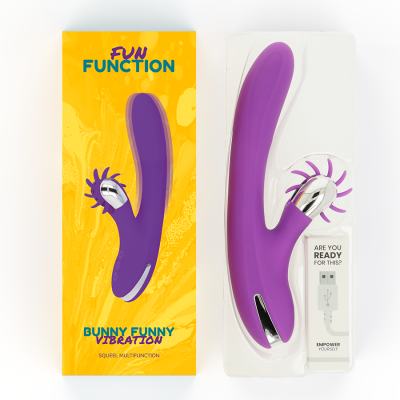 Vibrador roxo com estimulador de rodas em embalagem amarela e transparente