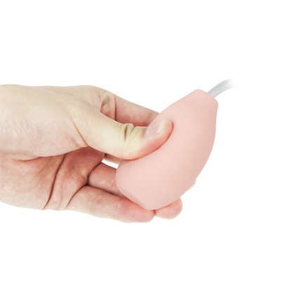 Dispositivo silicone cor de rosa claro segurado por mão
