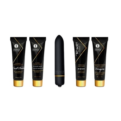 Conjunto de produtos Shunga preto e dourado com tubos de creme e objeto cilíndrico preto.