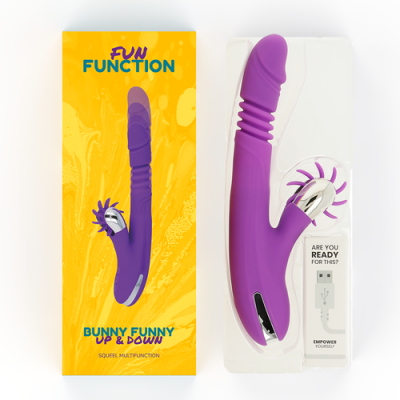 Vibrador roxo anatómico e estimulador adicional com embalagem amarela e instruções em inglês.