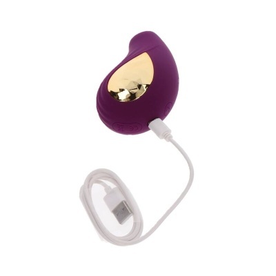 Produto eletrônico roxo com parte dourada e cabo USB branco para carregamento