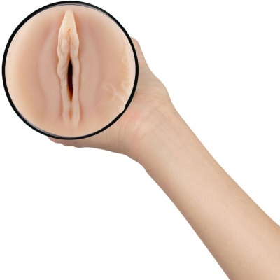 Objeto cilíndrico de cor pele com textura semelhante à pele humana