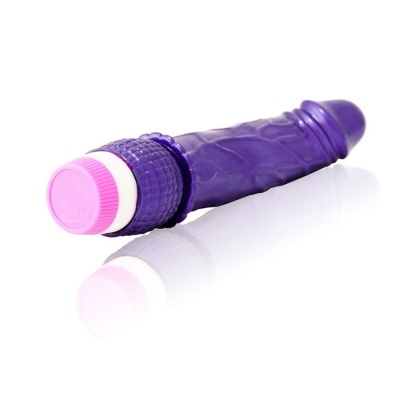 Vibrador roxo com extremidade rosada numa superfície branca refletora