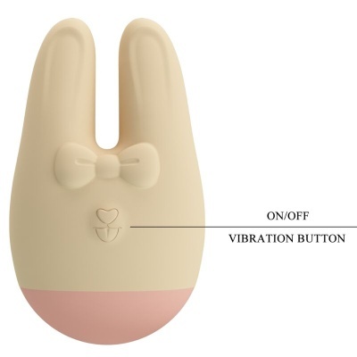 Dispositivo de silicone em forma de coelho bege com base rosa e botões em relevo