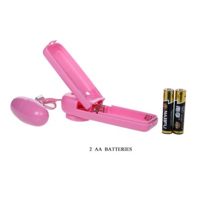 Dispositivo rosa com cápsula e pilhas AA ao lado