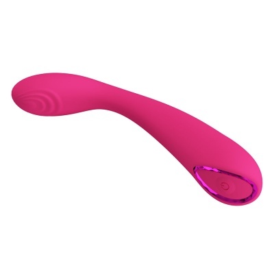 Vibrador cor-de-rosa com botão de ligar e textura circular na ponta