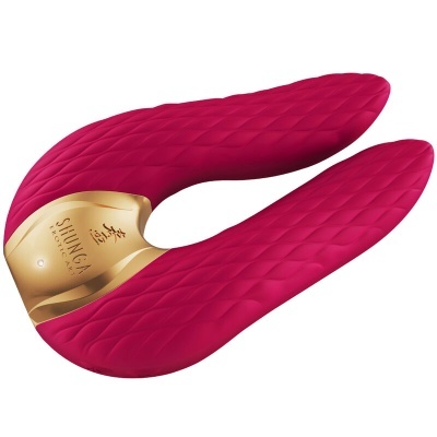 Produto vibrador cor-de-rosa com textura em padrão de losangos, forma em U, base dourada com texto