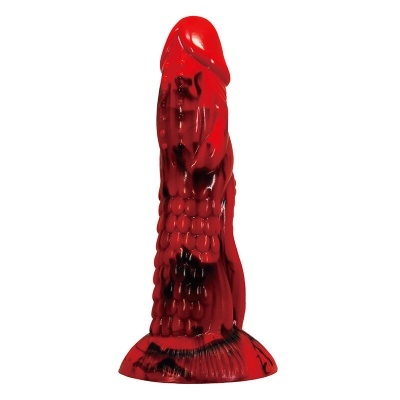 Objeto de silicone vermelho com detalhes pretos e textura de escalas