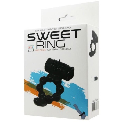 Embalagem branca SWEET RING com imagem de anel preto texturizado e detalhe cilíndrico