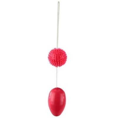 Produto composto por esfera rosa texturizada e forma oval vermelha ligada por fio