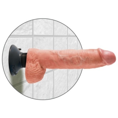 Dildo realístico rosa com ventosa preta fixado a azulejo branco