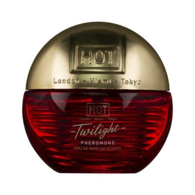 Frasco de perfume vermelho e dourado com texto impresso.