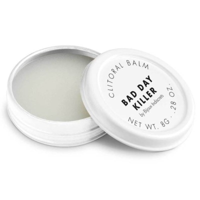 Bálsamo para clitóris em pote branco com tampa e texto preto