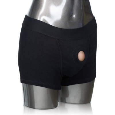 Cuecas boxer pretas com recorte circular frontal num manequim prateado