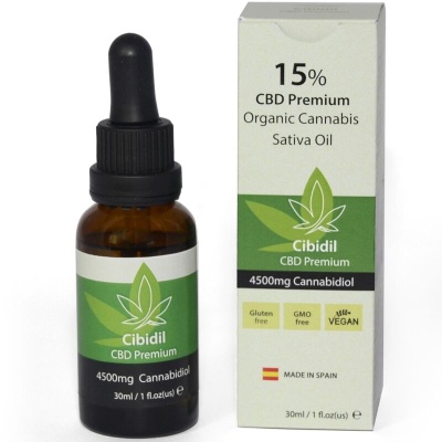Frasco âmbar com óleo de cannabis e embalagem branca e verde