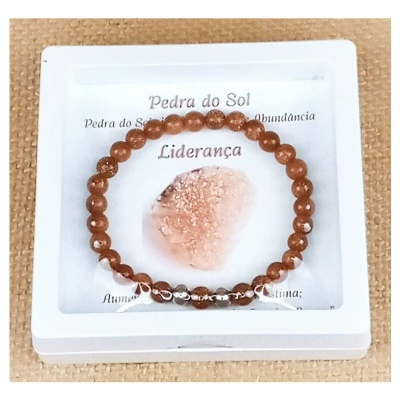 Pulseira de Pedra do Sol com caixa branca e texto em português