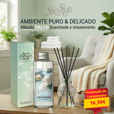 Difusor de ambiente com pauzinhos numa mesa e poltrona ao fundo