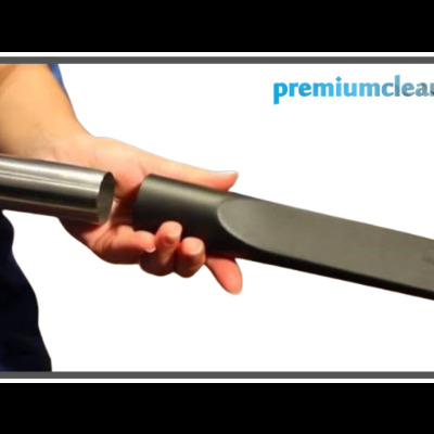 Acessório de aspiração preto com parte metálica e texto premiumcleaning