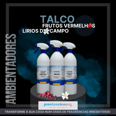 Três frascos de ambientadores premiumcleaning com diferentes fragrâncias sobre pedestal cinzento.