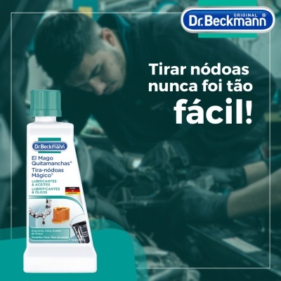 Produto Dr. Beckmann El Mago Quitamanchas em embalagem branca com tampa verde e texto promocional em fundo desfocado.