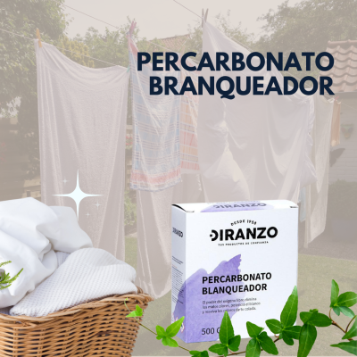 Caixa de percarbonato branqueador Diranzo ao lado de uma cesta com roupas brancas e varal ao ar livre