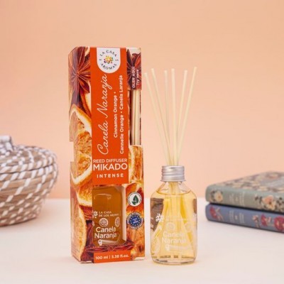 Difusor de varetas Canela Naranja em embalagem laranja com frasco transparente e tampa prateada