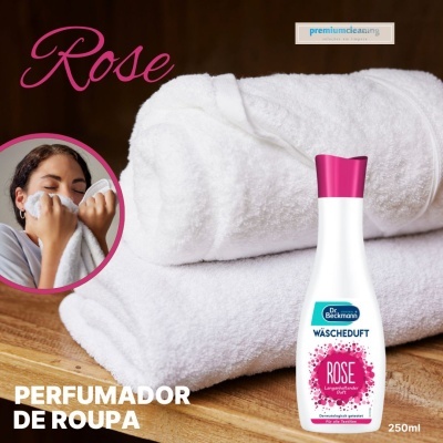 Perfume para roupa Rose Dr. Beckmann em embalagem branca com tampa rosa sobre toalhas brancas dobradas