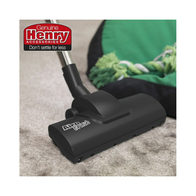 Cabeçote de aspirador de pó preto Airtech sobre carpete bege com manta verde