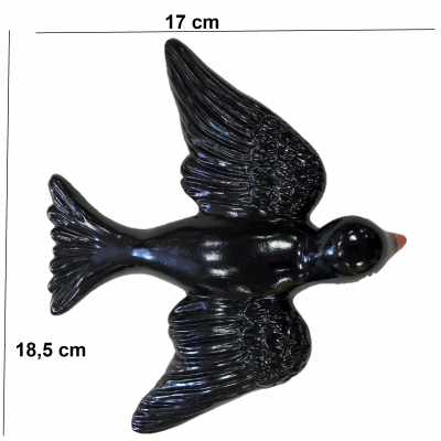 Figura decorativa de pássaro preto com bico castanho e dimensões indicadas