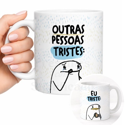 Caneca branca com ilustrações e texto em português sobre tristeza.